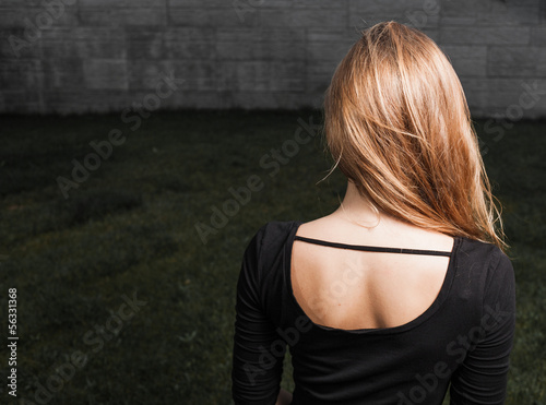 Photo: Beautiful young lady at night back view Beautiful young lady at night back view
