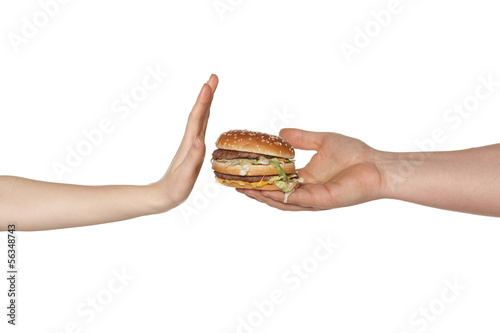 Photo: Female hand refusing the fast food meal Female hand refusing the fast food meal