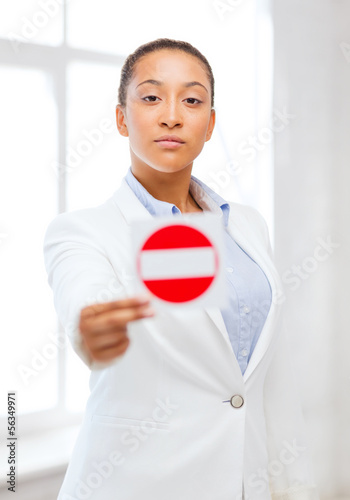 Photo: african woman showing stop sign african woman showing stop sign