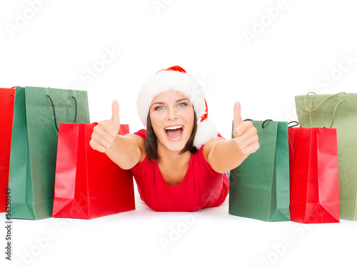 Photo: woman in red shirt with shopping bags woman in red shirt with shopping bags