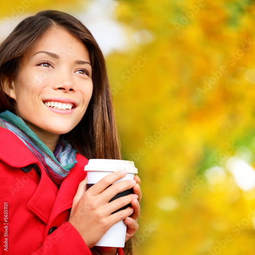 Photo: Coffee woman drinking coffee outside in fall Coffee woman drinking coffee outside in fall