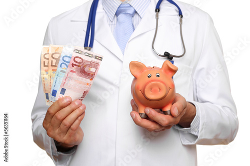 Photo: Arzt mit Geld und Sparschwein Arzt mit Geld und Sparschwein