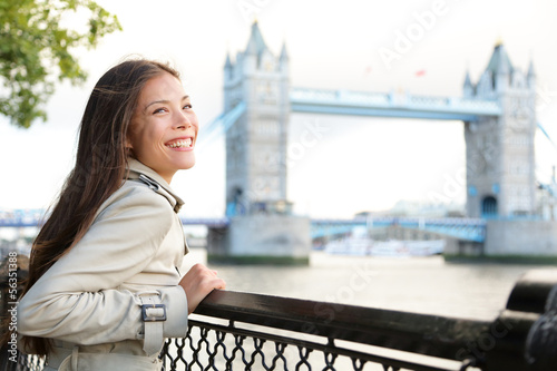 Photo: People in London - woman happy by Tower Bridge People in London - woman happy by Tower Bridge