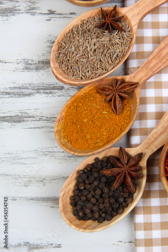 Photo: Various spices and herbs on table close up Various spices and herbs on table close up
