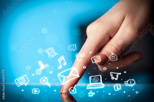 Photo: Finger pointing on tablet pc, social media concept Finger pointing on tablet pc, social media concept