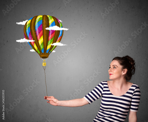 Photo: Woman holding a balloon drawing Woman holding a balloon drawing