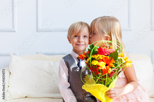 Photo: girl is kissing boy. girl is kissing boy.