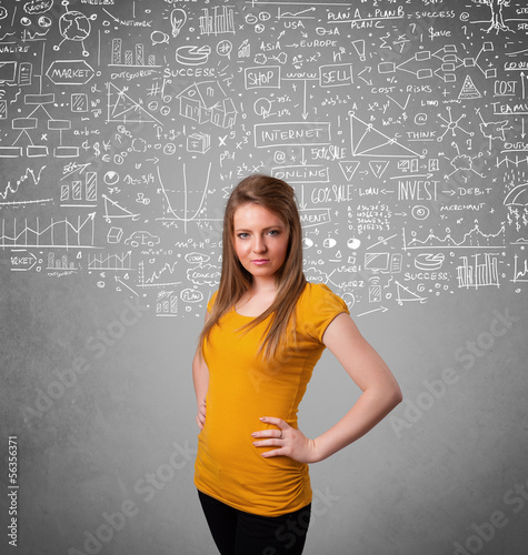 Photo: Young pretty lady with hand drawn calculations and icons Young pretty lady with hand drawn calculations and icons