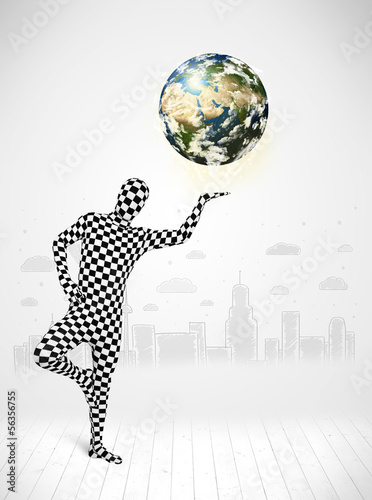 Photo: man in full body suit holding planet earth man in full body suit holding planet earth