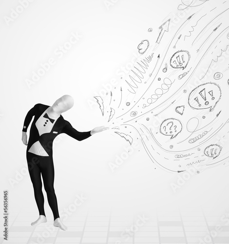 Photo: Guy in body suit morphsuit looking at sketches and doodles Guy in body suit morphsuit looking at sketches and doodles