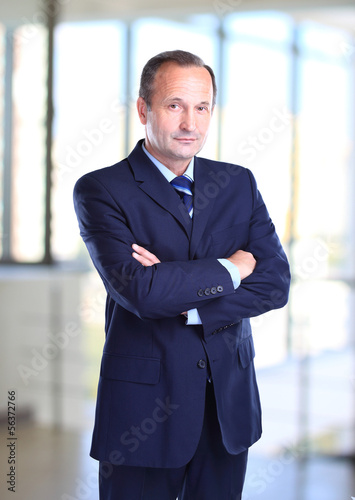 Photo: Portrait of a happy senior business man smiling Portrait of a happy senior business man smiling