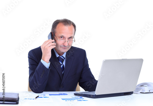 Photo: smiling business man talking on cell phone smiling business man talking on cell phone
