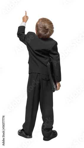 Photo: Child in a tuxedo pointing at wall. Rear view. Isolated over wh Child in a tuxedo pointing at wall. Rear view. Isolated over wh