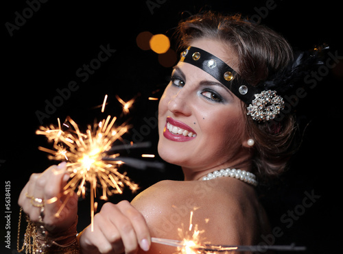 Photo: Happy woman with bengal lights Happy woman with bengal lights