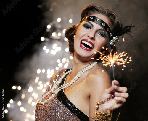 Photo: Happy woman with bengal lights Happy woman with bengal lights