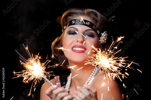 Photo: Happy woman with bengal lights Happy woman with bengal lights
