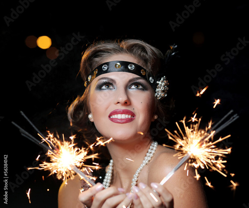 Photo: Happy woman with bengal lights Happy woman with bengal lights