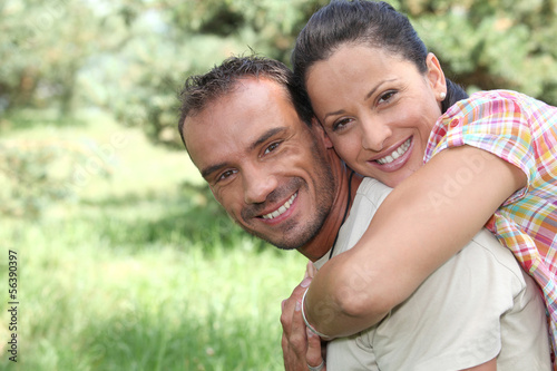 Photo: Playful couple in the park Playful couple in the park