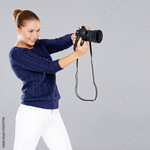 Photo: Pretty vivacious young female phoptographer Pretty vivacious young female phoptographer