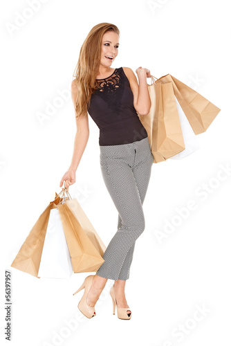 Photo: Trendy young woman with shopping bags Trendy young woman with shopping bags