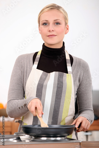 Photo: Blond woman with pan Blond woman with pan