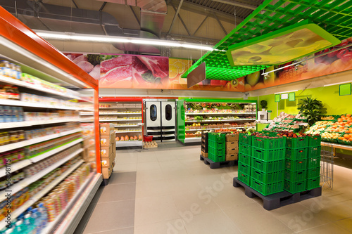 Photo: shelves with products in the supermarket shelves with products in the supermarket