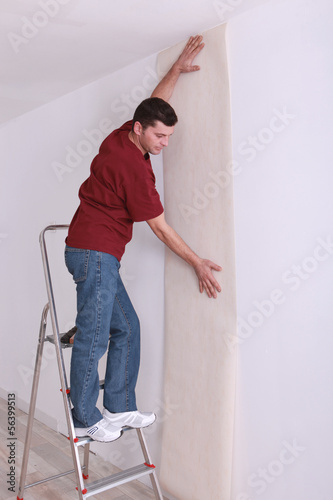 Photo: Decorator wallpapering Decorator wallpapering