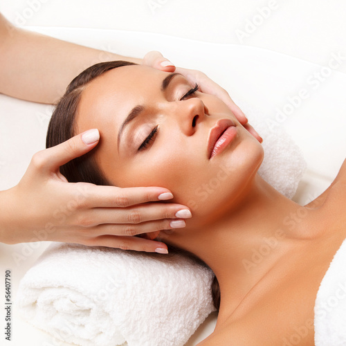  Face Massage. Close-up of a Young Woman Getting Spa Treatment.