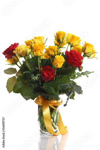 Photo: yellow and red roses in a vase yellow and red roses in a vase