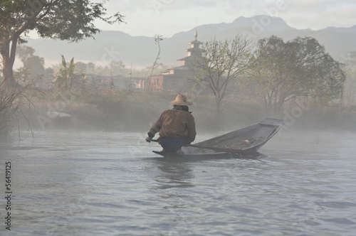 Photo: Pa-O tribe people floating in wooden boat on Inle lake, Myanmar Pa-O tribe people floating in wooden boat on Inle lake, Myanmar