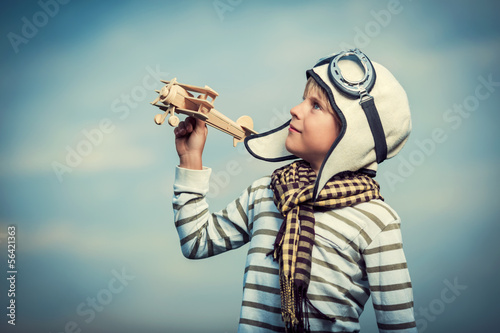 Photo: Boy with wooden plane Boy with wooden plane