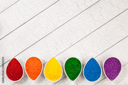 Photo: A rainbow border of colorful baking sprinkles A rainbow border of colorful baking sprinkles