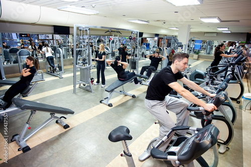 Photo: People workout at gym People workout at gym