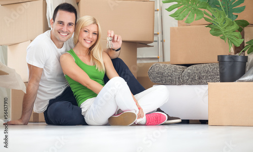 Photo: happy couple with key of new home happy couple with key of new home