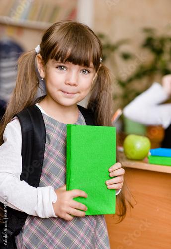 Photo: portrait of pretty preschool girl with backpack portrait of pretty preschool girl with backpack