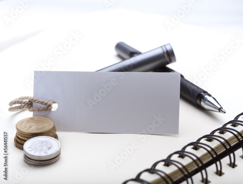 Photo: blank tag paper with finance concept blank tag paper with finance concept
