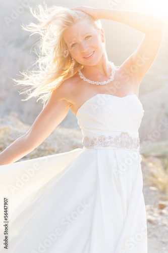 Photo: Beautiful bride posing on the mountain Beautiful bride posing on the mountain
