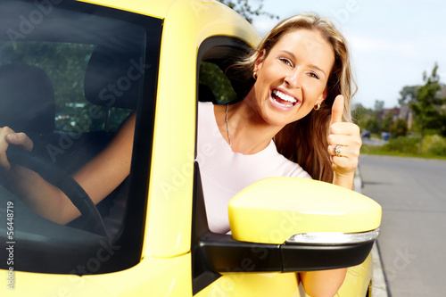 Photo: Woman car driver. Woman car driver.