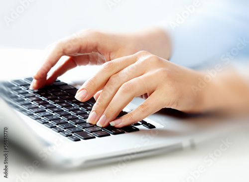 Photo: Hands with laptop computer keyboard. Hands with laptop computer keyboard.