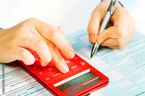 Photo: Hands with calculator. Hands with calculator.