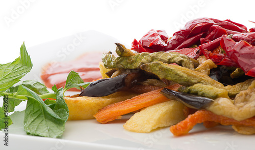 Photo: Stir fried vegetables isolated on white background Stir fried vegetables isolated on white background