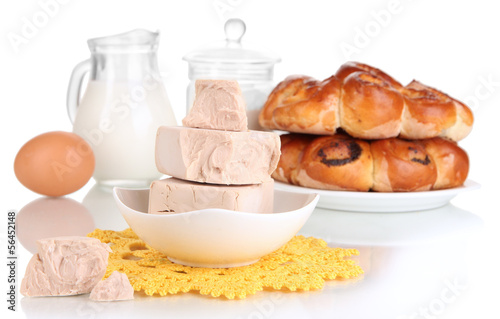 Photo: Dry yeast with pastry and baking ingredients isolated on white Dry yeast with pastry and baking ingredients isolated on white