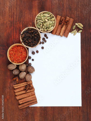 Photo: Various spices and herbs with empty white blank for recipe Various spices and herbs with empty white blank for recipe