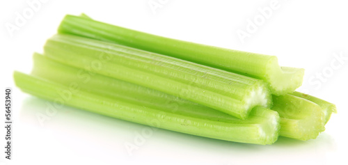 Photo: Fresh green celery isolated on white Fresh green celery isolated on white