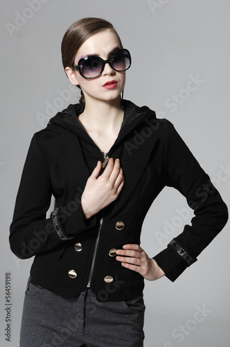 Photo: fashion model in sunglasses posing gray background fashion model in sunglasses posing gray background