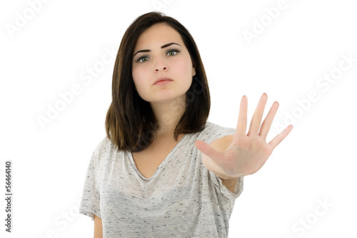 Photo: bright picture of young woman making stop gesture bright picture of young woman making stop gesture