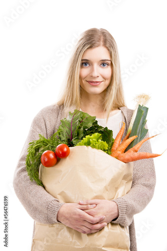Photo: Beautiful woman carrying vegetables Beautiful woman carrying vegetables