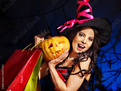Photo: Woman holding Halloween shopping bag. Woman holding Halloween shopping bag.