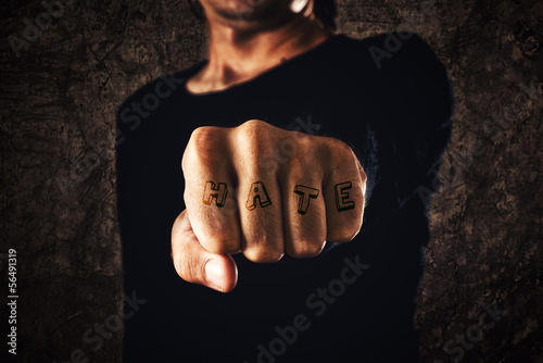 Photo: Hand with clenched fist - tattooed hate Hand with clenched fist - tattooed hate