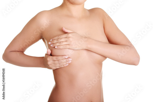 Photo: Woman examining breast mastopathy or cancer Woman examining breast mastopathy or cancer